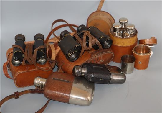 A set of leather-cased flasks, two pairs of binoculars, two spirit flasks and a set of leather-cased plated tumblers